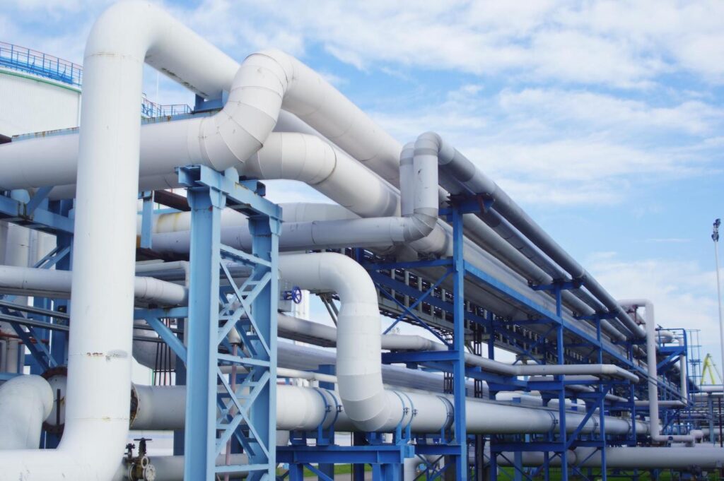 Insulated process pipework on a steel pipe rack at an industrial water treatment plant.